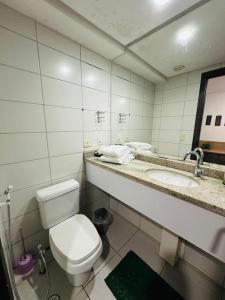 a bathroom with a toilet and a sink at Betel Beach Flat Boa Viagem in Recife +36 photos