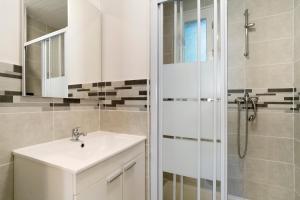 a bathroom with a sink and a shower at 15.La colline Clim.option- 6 pers in Calviac +33 photos