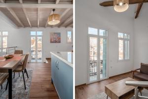 a kitchen and dining room with white walls and windows at The Three Admirals in Pylos