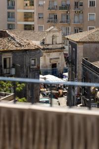 a view of a city from a balcony at Palazzo Settanta in Catania