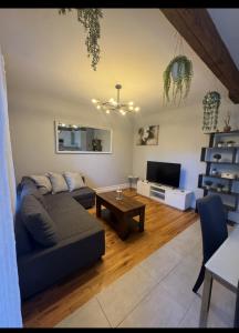 a living room with a couch and a table at La Pause Montréal in Montreal +3 photos