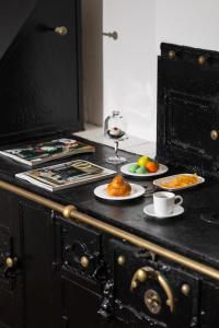 a kitchen counter with plates of food on it at Palazzo Settanta in Catania