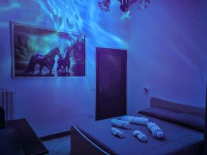 a living room with a couch and a picture of a horse at Il Chiostro di Ribot in Lugnano in Teverina