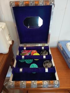 a glass box with three different watches in it at Chalet Les Buis in Saint-Paul-lès-Romans