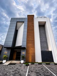 a building with a sign on the front of it at IP Hotels And Towers in Chori