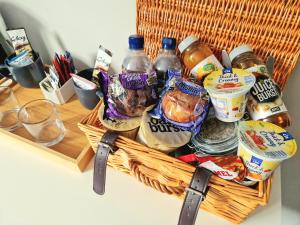 a basket filled with food and drinks on a counter at The Black Hat in Ilkley