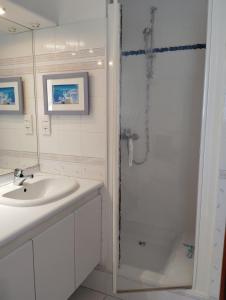 a white bathroom with a sink and a shower at La Maison du Petit Port in Nantes +57 photos