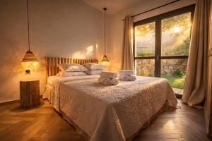 a bedroom with a bed with two stuffed animals on it at Casa Campo Longo in Belgodère