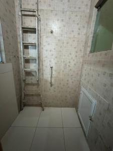 a bathroom with a shower with a tiled floor at Espaço rosa mar in Aracaju +23 photos
