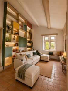 a large living room with a couch and a table at Entre Ciels et Lettres in Grignan