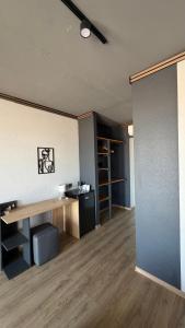 an empty room with a desk in a room at LESS HOTEL Затока in Zatoka +39 photos
