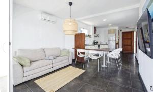 a living room with a couch and a table at Kanavayen Tres in Santanyi