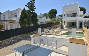 a house with two ping pong tables on top of it at Kanavayen Tres in Santanyi