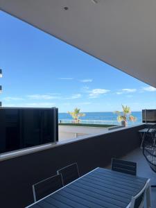 a view of the ocean from the balcony of a house at Sul Mare in Molfetta +7 photos