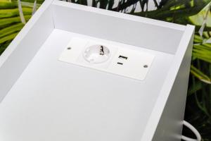 a white box with a usb charger in it at Beach House - Affittacamere Paola in Paola