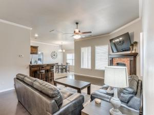 a living room with a couch and a table at Unpack and Unwind in Yukon