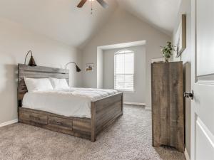 a bedroom with a large bed and a window at Unpack and Unwind in Yukon