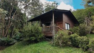 a wooden cabin in the middle of a forest at MAGDA Nature Lodge in El Retiro