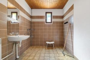a bathroom with a sink and a toilet in it at 10. cerisiers option clim- 4 pers in Calviac +30 photos