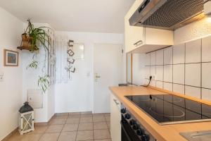 a kitchen with a sink and a stove at Fewo in der Altstadt - Enz in Bietigheim-Bissingen
