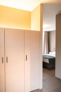 a bedroom with white cabinets and a bed at Albergo Canzo in Canzo +48 photos