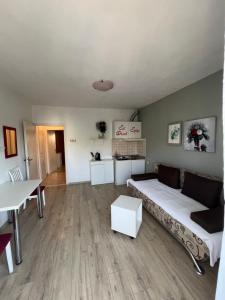 a living room with a bed and a table at Vila Marinessa in Hvar +32 photos