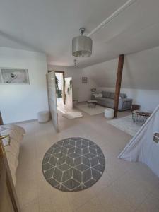 a large living room with a couch and a rug at Villa La Digue in Plobsheim +42 photos