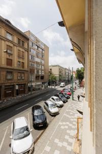 a row of cars parked on the side of a street at #Artistic Flat 2BR Historical Center Timișoara in Timişoara