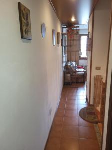 a hallway of a house with a tile floor at Casa Bella Vista in Foppolo