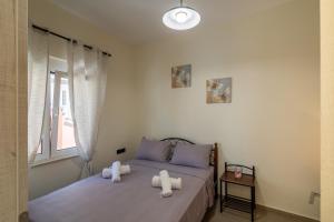 a bedroom with two beds with towels on them at Stellasrooms in Mytilene