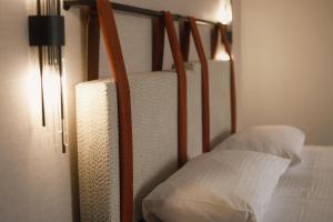 a room with two bunk beds with white pillows at Jetel Boutique Hotel in Almaty