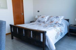 Llit o llits en una habitació de Distrito