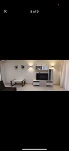 a living room with a stove and a microwave at Veranda resort in Hurghada