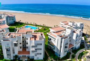 an aerial view of the beach and buildings at Ocean Therapy in Dar Oulad Hajj Kassem