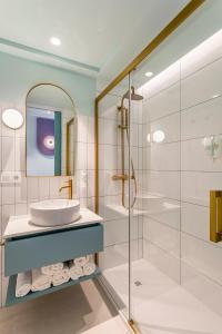 a bathroom with a sink and a shower at Blue Malva in Valencia +93 photos