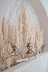 a painting of a bunch of wheat on a wall at AMAREA BOUTIQUE Hotel in Eforie Sud +115 photos