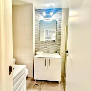 a white bathroom with a sink and a mirror at Hercules in Arroyo de la Miel +17 photos
