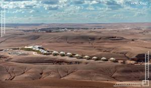an aerial view of a farm in the desert at Agafay Camping in Aït Daoud