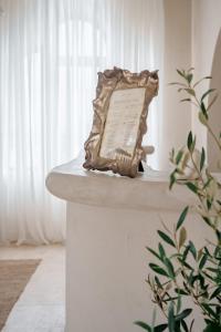 a statue sitting on a counter in a room at AMAREA BOUTIQUE Hotel in Eforie Sud