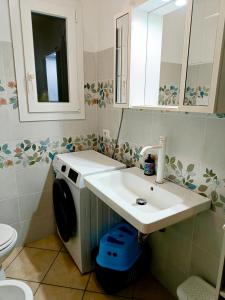 a bathroom with a sink and a toilet at Il Posto Giusto tra cielo e mare in Pantelleria