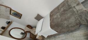 a bedroom with a bed and a mirror at Casa Italiannebrasille in Castellana Grotte +51 photos