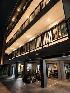 a large building with a bunch of windows at La Vie Résidence in Chiang Mai