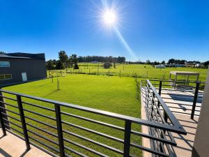 a view of a baseball field from a balcony at Hotel Cardal Tandil in Tandil