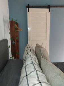 a bed with pillows on it in a room at La Adelita in Chascomús