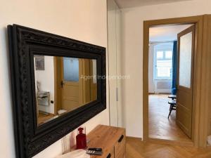 a mirror sitting on top of a dresser in a room at Downtown luxury segment in Braşov