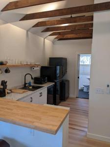 a kitchen with a counter top in a room at Cabin Oasis near Town in Catskill +7 photos