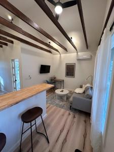 a living room with a bar and a couch at Cabin Oasis near Town in Catskill