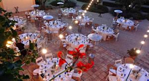 an overhead view of a wedding reception with white tables and chairs at Can Lluís in Capellades +34 photos