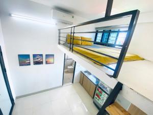 a room with two bunk beds on the stairs at 46 An Hòa, Mỗ lao in Hanoi