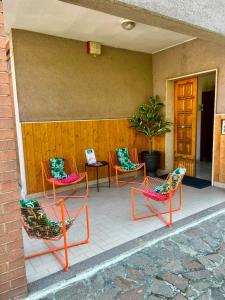 a group of chairs sitting on a patio at Motor Rooms in Maranello